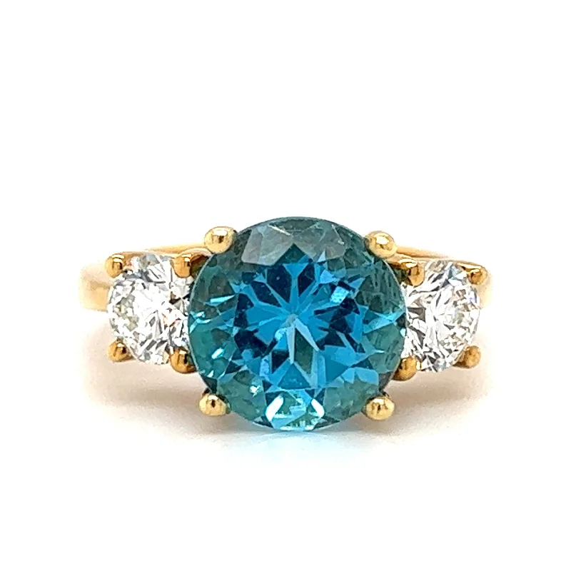 Engagement ring with pink diamond for women-Pre-Owned 18k Yellow Gold Blue Topaz & Diamond Three Stone Ring